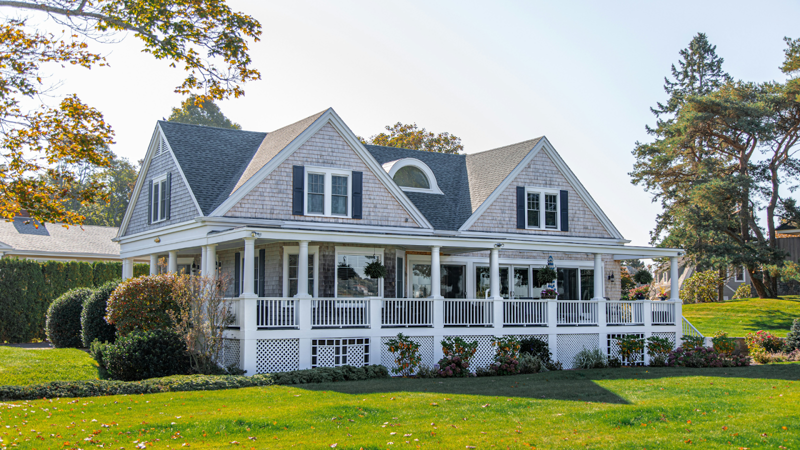 Gray wooden house with white porch