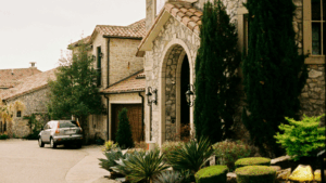 Stone three-story home with elliptical archway