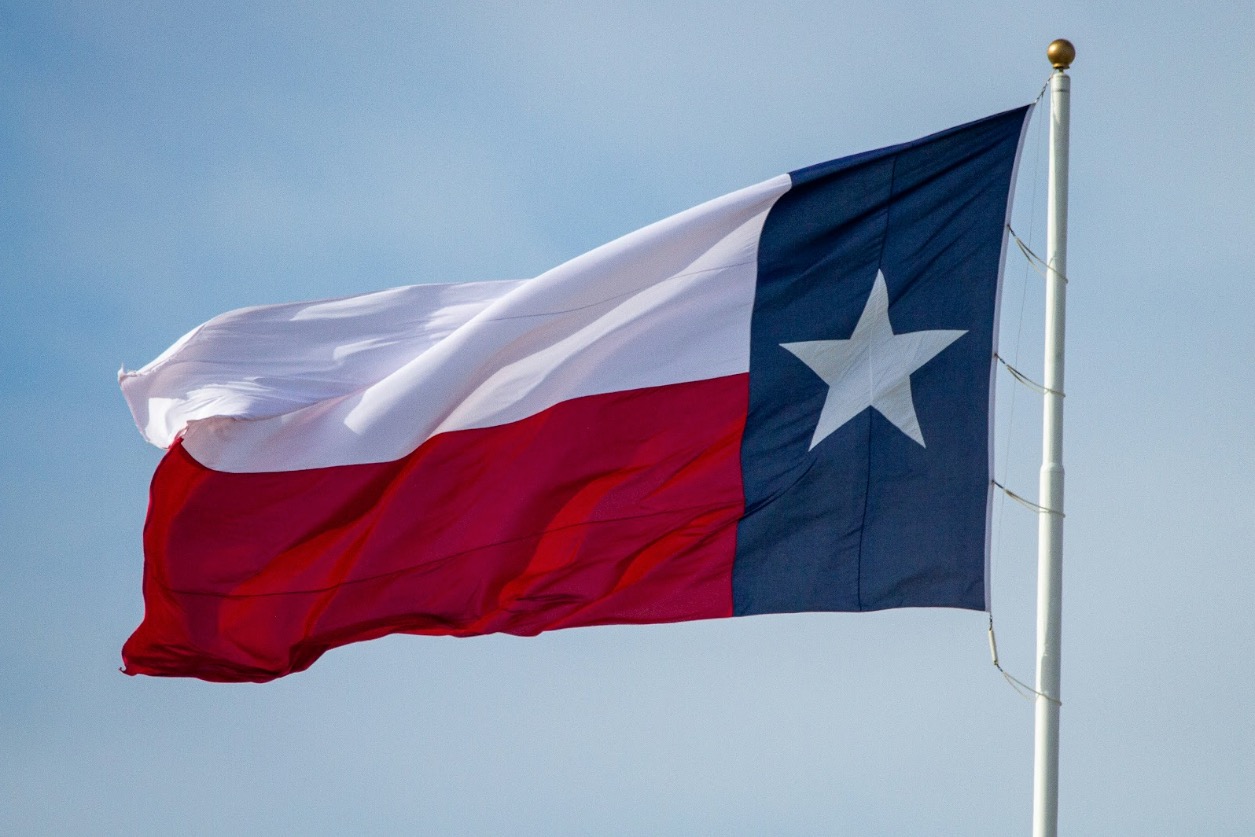 Texas flag being flown after the reader learned how Texas property tax rates compare to other states.
