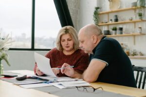 Man and woman discussing common mistakes homeowners make when protesting property taxes