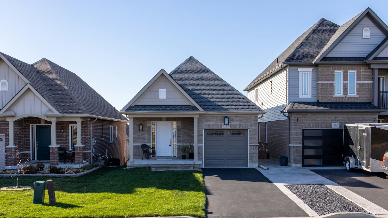 A row of small brick homes in a quiet neighborhood
