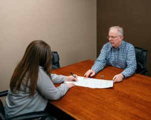 Man meeting with a tax professional after reading Texas Tax Protest's blog "Property Tax Protest Tips for Retirees and Seniors in Texas"